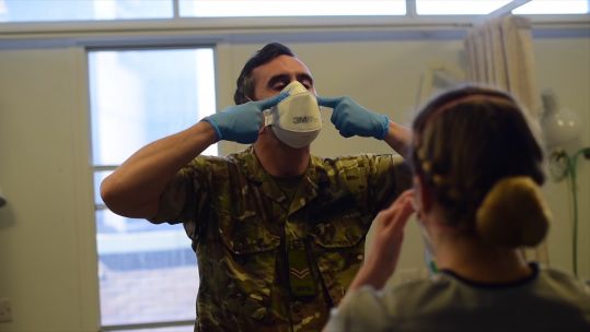 Soldier shows NHS staff how to ensure PPE is fit well 280420 CREDIT Army in Scotland.jpg 