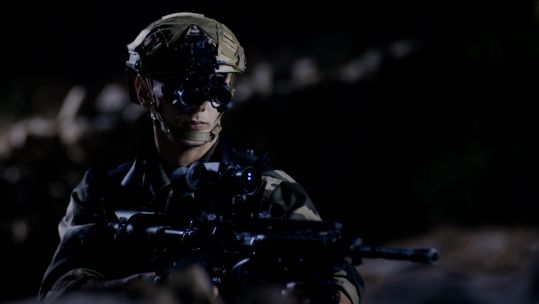 Soldier wearing the new XACT nv33 binoculars