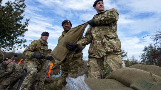Troops lay sandbags down in Fishlake, South Yorkshire (Picture: MOD).