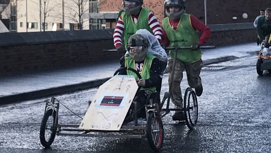 Cover image: Soldiers of 2 Rifles enjoy improvised sleigh races at Thiepval Barracks in Co Antrim (Picture: PA).