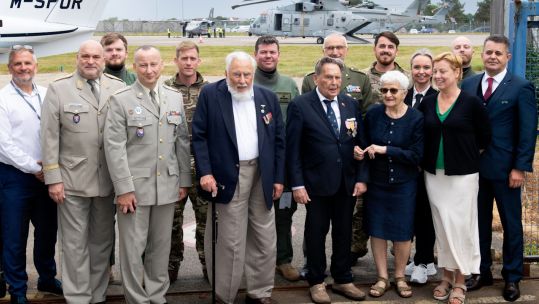 Members of the aircrew standing with Czech veterans Charles Strasser and Jirí Pavel Kafka in front of the 845 NAS Merlins in Jersey (Picture: Royal Navy)