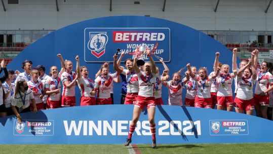 St Helens players celebrate winning the Women's Challenge Cup final match at the Leigh Sports Village, Manchester