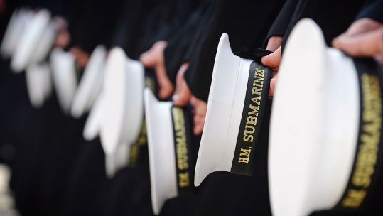 Submariners of HMS Victorious holding their caps during an inspection by the Commanding Officer CREDIT Crown Copyright