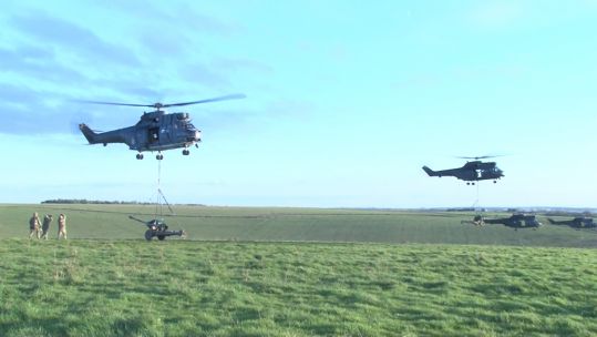 Synchronised lifting of field guns by Pumas on Salisbury Plain 041219 CREDIT BFBS