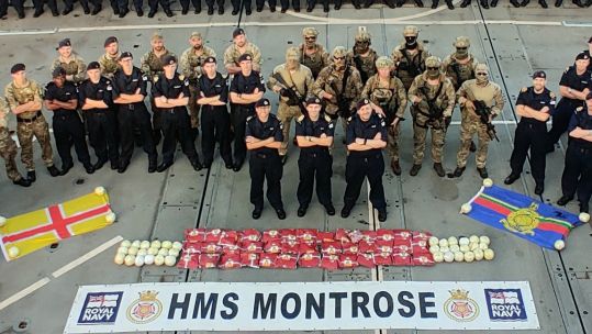 Team Montrose show off their drugs haul on the frigate's flight deck cropped CREDIT RN