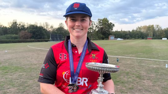 The Army's Georgina Dean holds aloft silverware after her stellar century helped her team beat the RAF in the final match and retain their Inter Services T20 crown (Picture: BFBS)