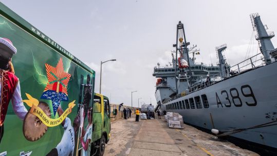 The Barbados Defence Force delivers aid to the jetty for loading on to RFA Wave Knight, which took the items to St Vincent