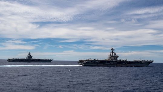 Cover image: USS Ronald Reagan and USS Nimitz in the South China Sea (Picture: US Department of Defense).