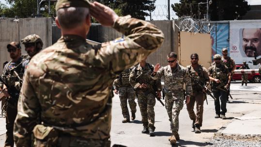 The Regimental Sergeant Major 3rd Battalion The Royal Regiment of Scotland salutes United States Army General Austin Scott Miller at flag lowering ceremony at New Kabul Compound Afghanistan 28052021 CREDIT MOD.jpg