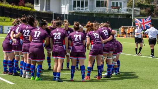 The UKAF players show team unity on the pitch with the British flag flying proudly in the background Credit Alligin Photography Date 11102022.jpg
