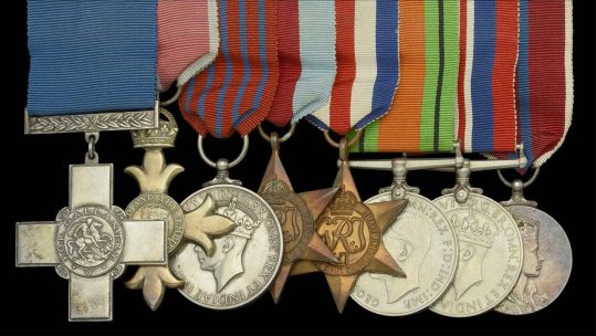 The set of eight medals belonging to Lt Commander Mick Gidden included the George Cross and George Medal