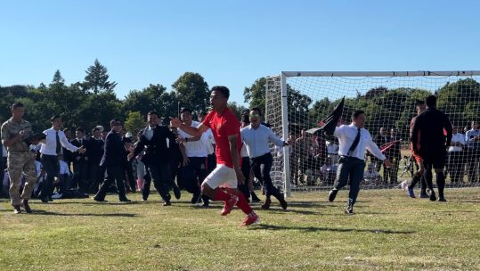 The moment the Queen's Gurkha Engineers celebrate the winning penalty in the Nepal Cup final.