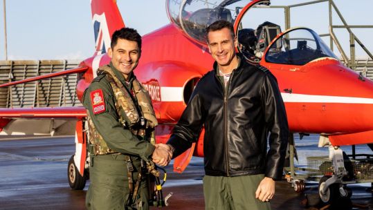 The new Officer Commanding of the Red Arrows Wg Cdr Adam Collings (right) with departing OC Wg Cdr David Montenegro