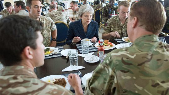 Theresa May eats lunch with British soldiers in Kenya CREDIT BFBS