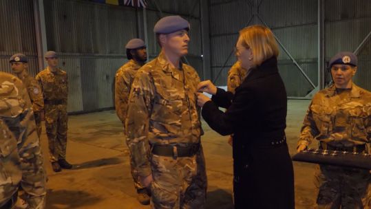 Troops receiving medals for work on Op Tosca.