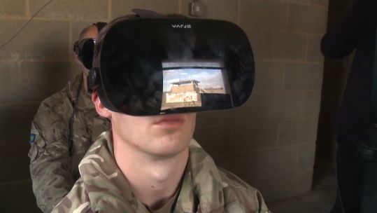 Troops using Virtual Reality training simulator, which can emulate a prototype of the Challenger 3 tank