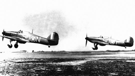 Two RAF Hawker Hurricane MK1 fighters from RAF 79 Squadron taking off from RAF Hawkinge, Kent during the Battle of Britain (Picture: PA).
