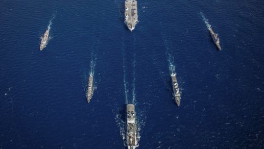 RFA Tideforce (lead), HMS Northumberland (left), USS Truxton (far left), HMS Dragon (right), USS Philippine Sea (far right) with HMS Queen Elizabeth at the rear during Exercise Westlant 19.