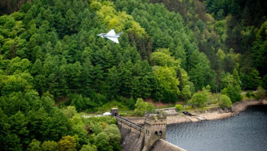A Typhoon flies over the Derwent Dam in Derbyshire as part of the Dambusters 75th anniversary (Picture: PA).