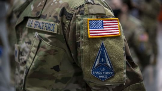 U.S. Airmen assigned to Travis Air Force Base, California, transition into the U.S. Space Force during a ceremony at the 621st Contingency Response Wing, Travis AFB, California