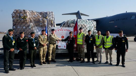 UK military personnel handing over medical equipment to help the Nepali Army battle coronavirus