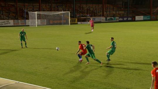 UKAF and Bundeswehr players compete for the ball in their Game of Remembrance at Aldershot Town FC.