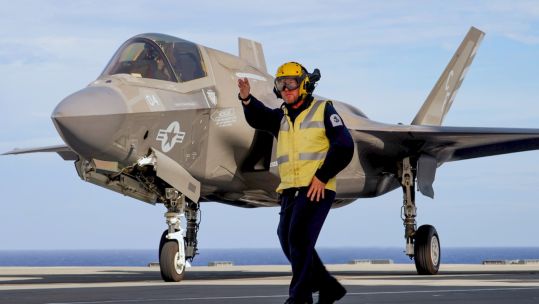 US Marine Corps on F-35B takes off from HMS Queen Elizabeth during cross decking exercises with USS America