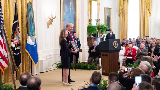 President Trump presents the medal to Sergeant Chapman's family