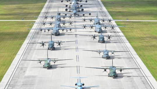 US, Australian and Japanese aircraft performing an 'Elephant Walk' formation in Guam
