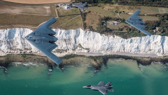 The aircraft fly over the white cliffs of England's south coast near Dover (Picture: MOD).