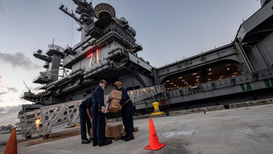 Cover image: USS Theodore Roosevelt docked in Guam earlier this month (Picture: US Department of Defense).