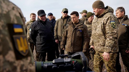 Ukrainian President Volodymyr Zelensky listening to explanations during a military drill outside the city of Rivne 160222 CREDIT Ukrainian Defense Ministry, UPI, Alamy Live News.jpg