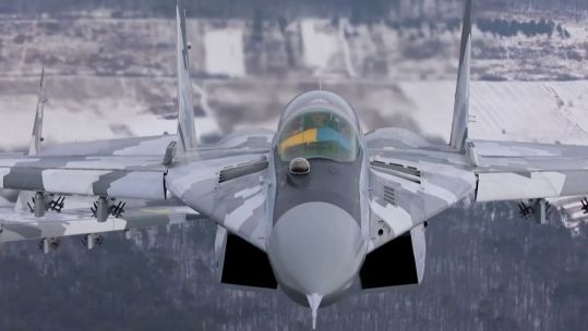 Ukrainian aircraft, with Ukrainian flag, in flight 