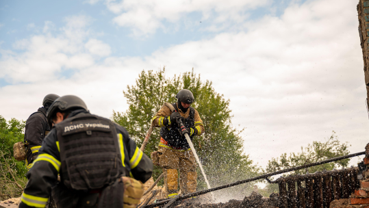 Ukrainian firefighters work to extinguish a fire at the home of Sergey Zamesov, which was bombed by the Russian military, killing his wife Inna Zamesova 310724 CREDIT ALAMY