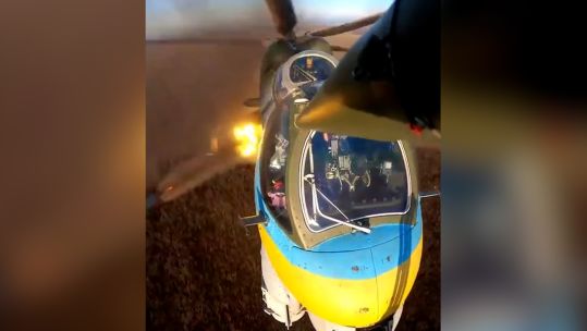 Ukrainian helicopter flying low and firing weapons