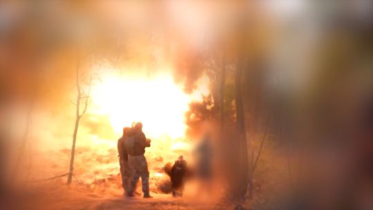 Ukrainian personnel standing just metres from where a Russian shell landed, but the personnel only recieved minor injuries 221124 CREDIT RFE RL , Ukrainian Service