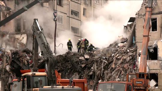 Ukrainian rescuers searching through the rubble after a Russian attack on an apartment block in Dnipro