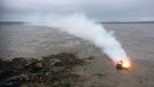 Unexploded munition on fire in the Gower Peninsula (Picture: Royal Navy).