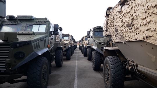Vehicles lined up on a ship about to head on Nato's Exercise Steadfast Dart