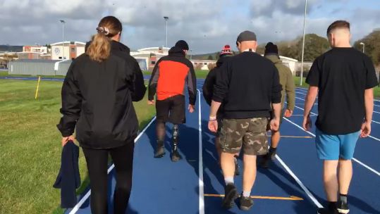 Veteran Steve Owen (front left) takes on his 457 lap challenge for Afghanistan fallen (Picture: Owen family).
