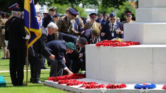 Cover image: Veterans lay wreaths at Bayeux Cemetery on the 75th anniversary of D-Day (Picture: MOD).