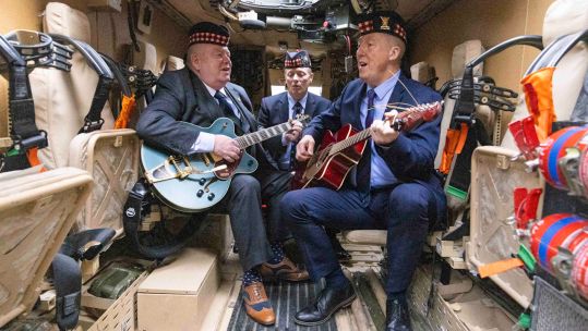 Warriors creators Alex Shannon (middle), Danny Muir (right), and Peter McKinlay (left) jamming in the back of a mastiff (Picture: Duncan McGlynn).