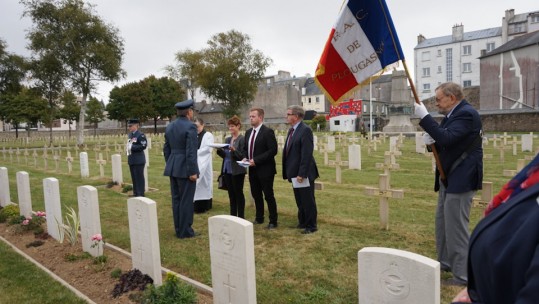 Wg Cdr Yves Gagnon presents Union flag to Flying Officer David Stein's cousin