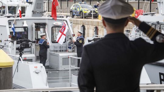The White Ensign was hoisted on HMS Cutlass in a ceremony in Gibraltar (Picture: Royal Navy).