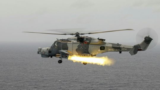 Wildcat helicopter with 815 NAS firing Martlet missiles in Bay of Bengal