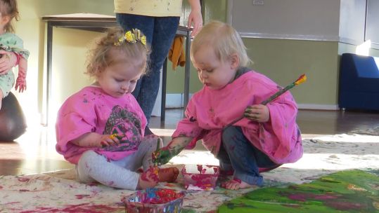 Young artists at work helping to create a mural for Colinton Tunnel.