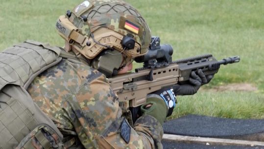 Member of the German Fallschirmjäger regiment firing the SA80 during training with 1 Rifles