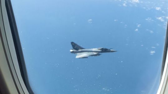 French Fighter Plane Shadows 'Terrified' Brits Flying Home