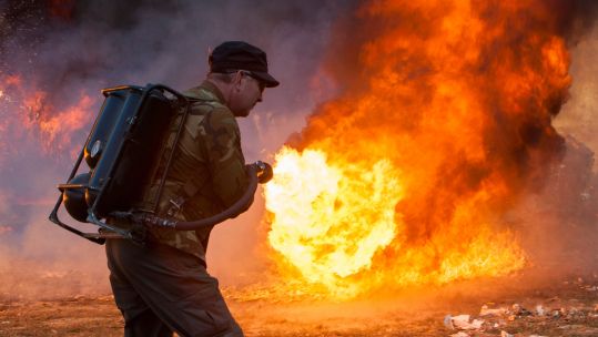 A flamethrower at the Knob Creek Machine Gun Shoot. Picture: Kristoffer Tripplaar / Alamy