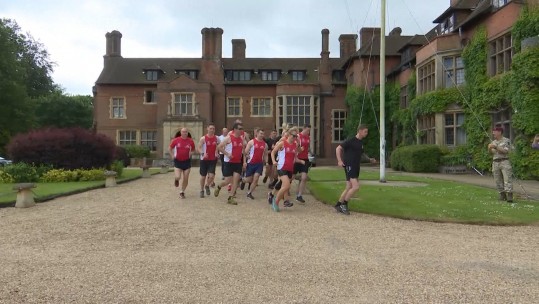 The runners leave Headley Court. 